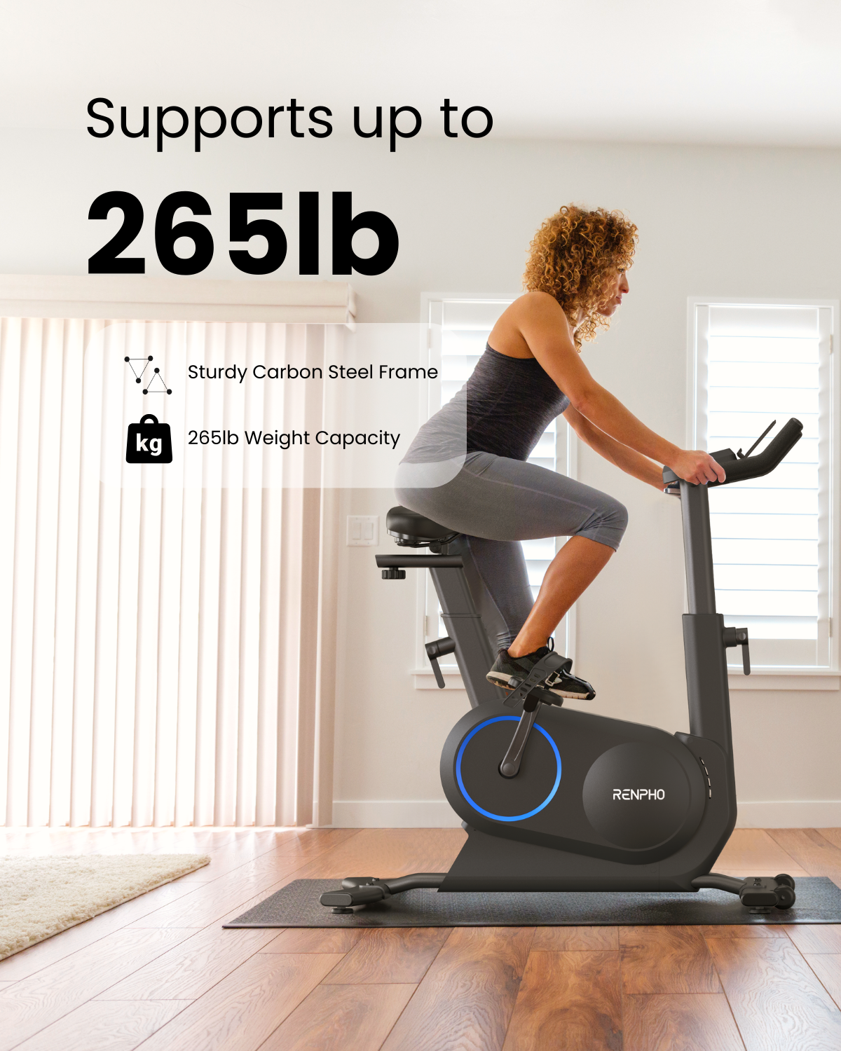 A woman with curly hair is working out on a Renpho EU AI Smart Bike S in a well-lit home interior. The image highlights the bike's features like its 265 lb weight capacity and sturdy carbon steel frame.