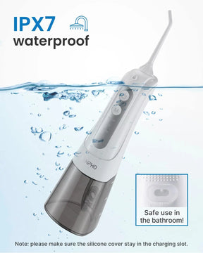 Image showing a Renpho EU Cordless Water Flosser submerged halfway in water to illustrate its IPX7 waterproof rating. The device has a white body and a transparent water tank. A close-up inset highlights the silicone cover with a note: "Safe use in the bathroom! Note: please make sure the silicone cover stays in the charging slot." Includes 360° rotating tips for thorough cleaning.