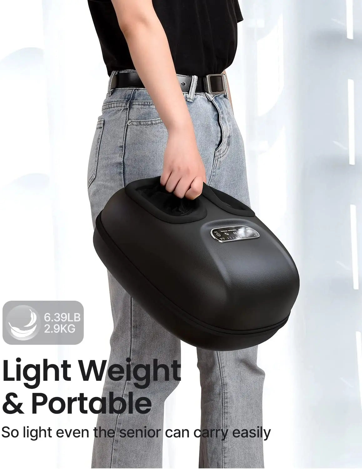 A person holding a Shiatsu Foot Massager Lite by Renpho EU against a white and gray background. Text on the image reads "Light Weight & Portable - 6.39LB 2.9KG - So light even the senior can carry easily." The person is wearing light blue jeans and a black shirt, ready for a customized massage experience.