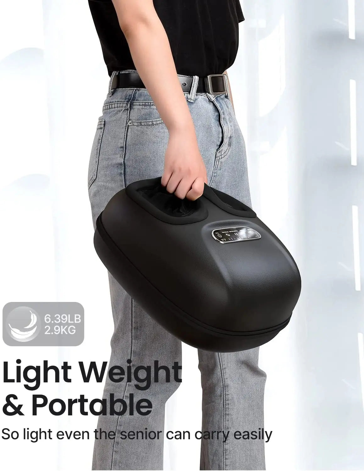 A person in light jeans and a black t-shirt is holding the Renpho EU Shiatsu Foot Massager Machine [2nd Generation], a compact, black, portable device with a handle. The image includes text stating "Light Weight & Portable" and "6.39LB 2.9KG." The caption highlights its ease of use for seniors, making it perfect for relaxing and relieving sore feet.