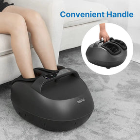 A person is sitting on a couch with their legs extended, enjoying the shiatsu kneading of the Renpho EU Shiatsu Foot Massager with Handle. The sleek black foot massager features a control panel on top and a convenient handle, as shown in an inset image. The background includes a light-colored couch and a gray carpet. Text reads "Convenient Handle".