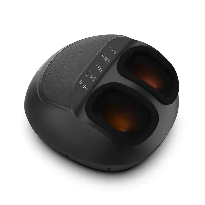 A black, dome-shaped Renpho EU Shiatsu Foot Massager Premium with two foot slots lined with a soft material. The top surface features a textured area and a control panel with multiple buttons and indicators. The foot slots emit a warm, orange light, suggesting deep kneading foot massage to relax your body.